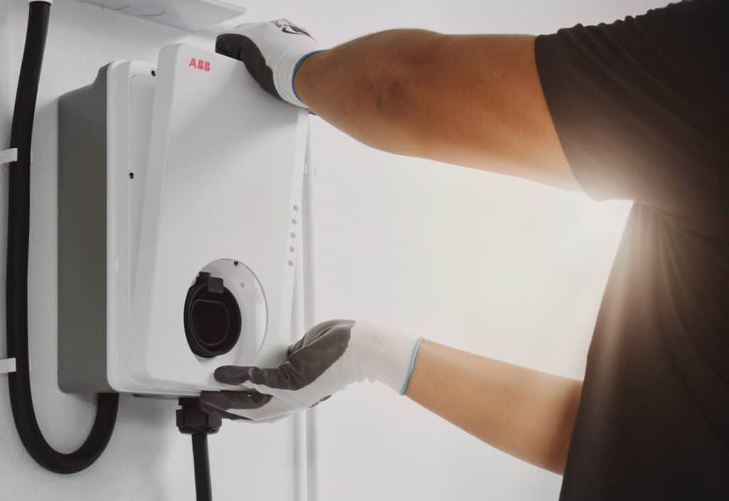 Auckland electrician installing ABB Terra AC Wallbox EV chargers with safety and quality workmanship.